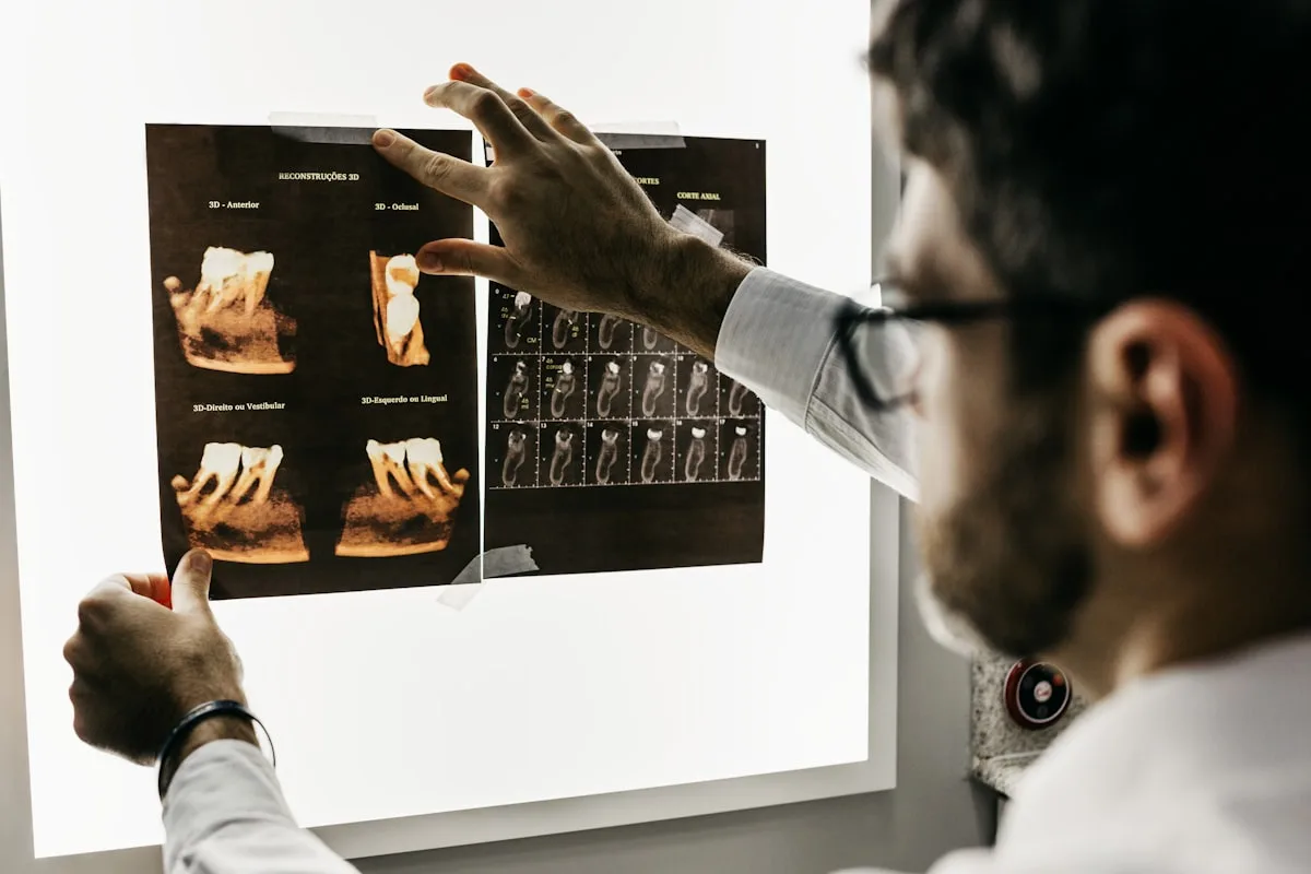 Dentist holding aligner